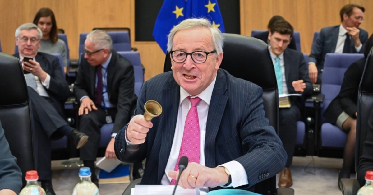 President of the European Commission Jean-Claude Juncker, center, rings a bell to open the Weekly College meeting at the European Commission headquarters in Brussels, Belgium, April 3, 2019. (AFP Photo)
