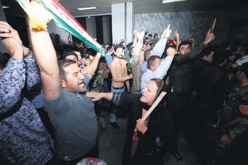Demonstrators gather outside the KRG parliament building in Irbil, Iraq, Oct. 29.
