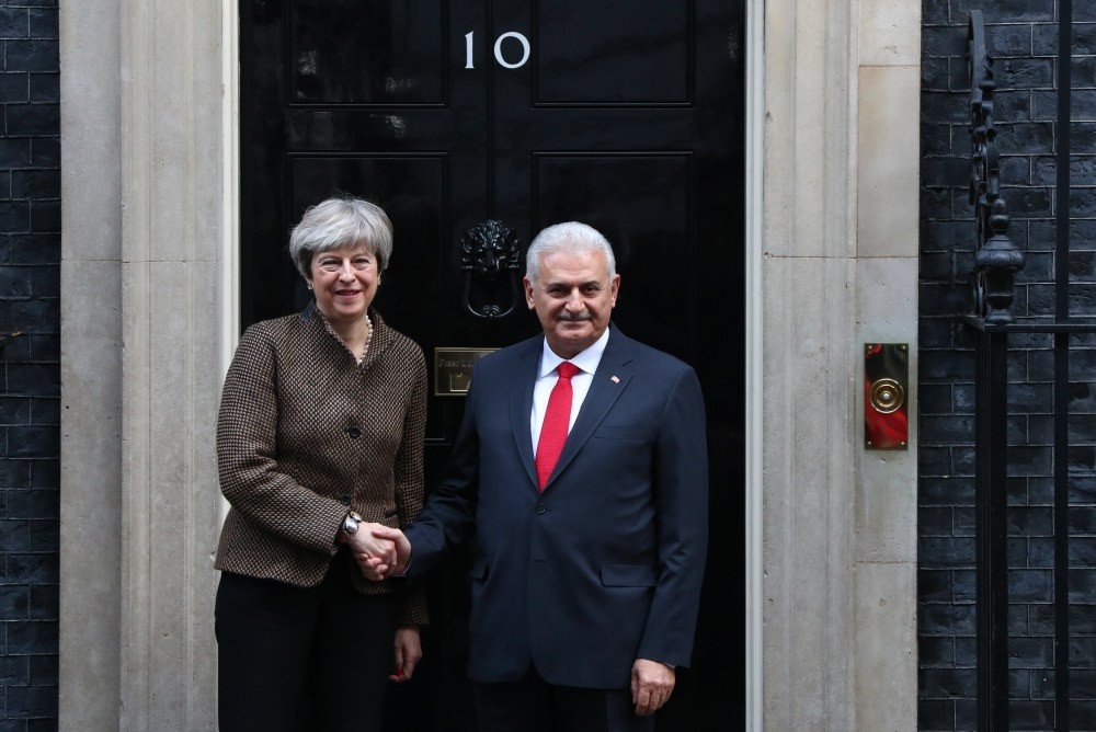British Prime Minister May greets Prime Minister Yu0131ldu0131ru0131m for their bilateral meeting at number 10 Downing Street in central London, Nov. 27. 