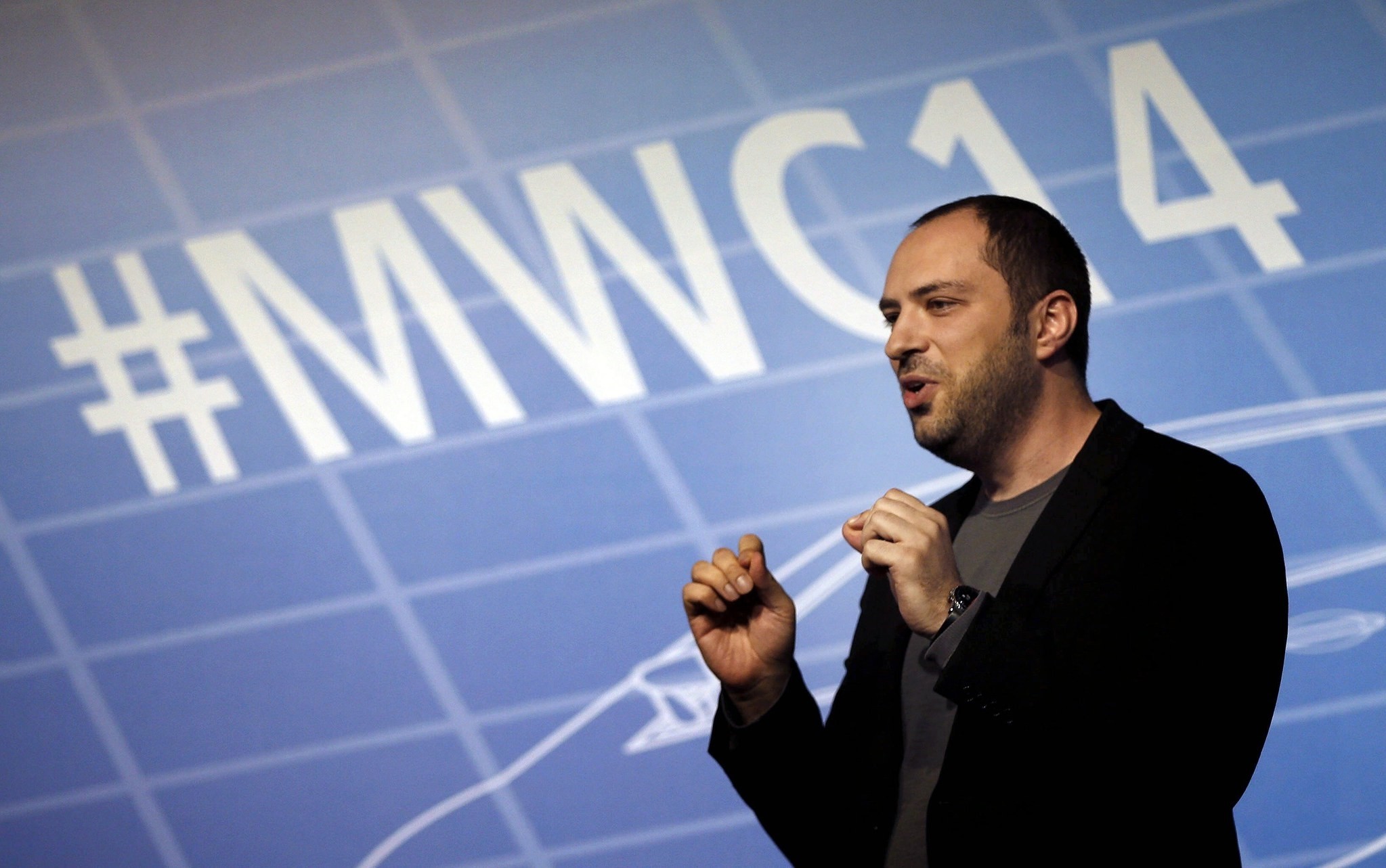 WhatsApp message appu2019s co-founder, Jan Koum, delivers a speech as he takes part in a debate held on the sidelines of the Mobile World Congress in Barcelona in 2014.