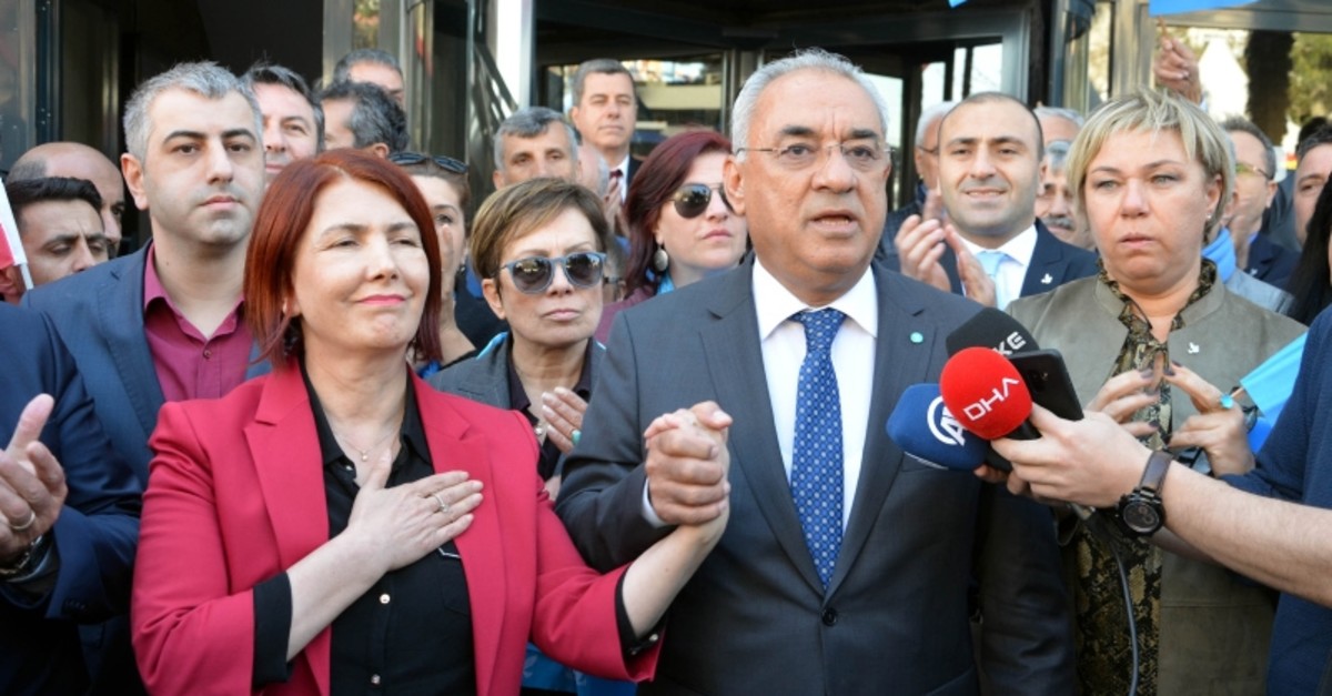 DSP Avcu0131lar mayor candidate Handan Ekrem Benli (Left) holds hands with DSP Chairman u00d6nder Aksakal in show of solidarity during a news conference (DHA Photo)