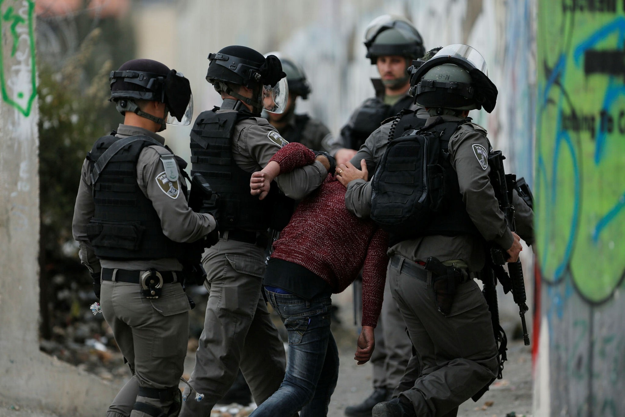 Israeli border police arrest a Palestinian protester during clashes following protests against Trump's decision to recognize Jerusalem as the capital of Israel, in the West Bank city of Bethlehem, Friday, Dec. 22, 2017. (AP Photo)