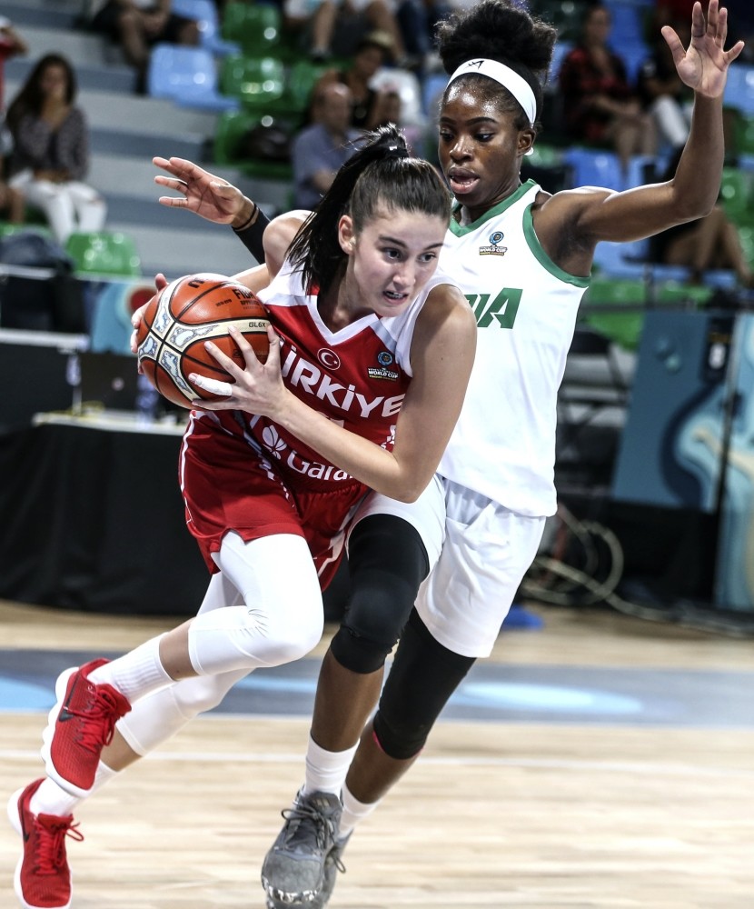 Turkey's Olcay u00c7aku0131r Kurt vies for ball in the group match against Nigeria on Sunday.