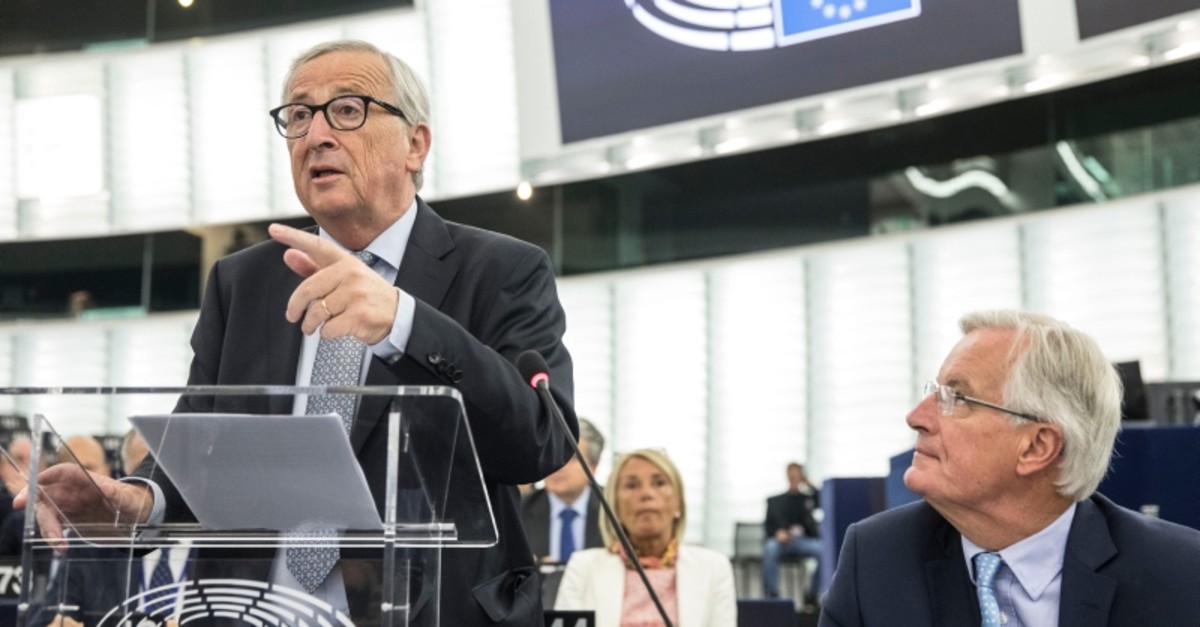 European Commission president Jean-Claude Juncker speaks while European Union chief Brexit negotiator Michel Barnier, right, looks on, Wednesday, Sept. 18, 2019 in Strasbourg, eastern France. (AP Photo)