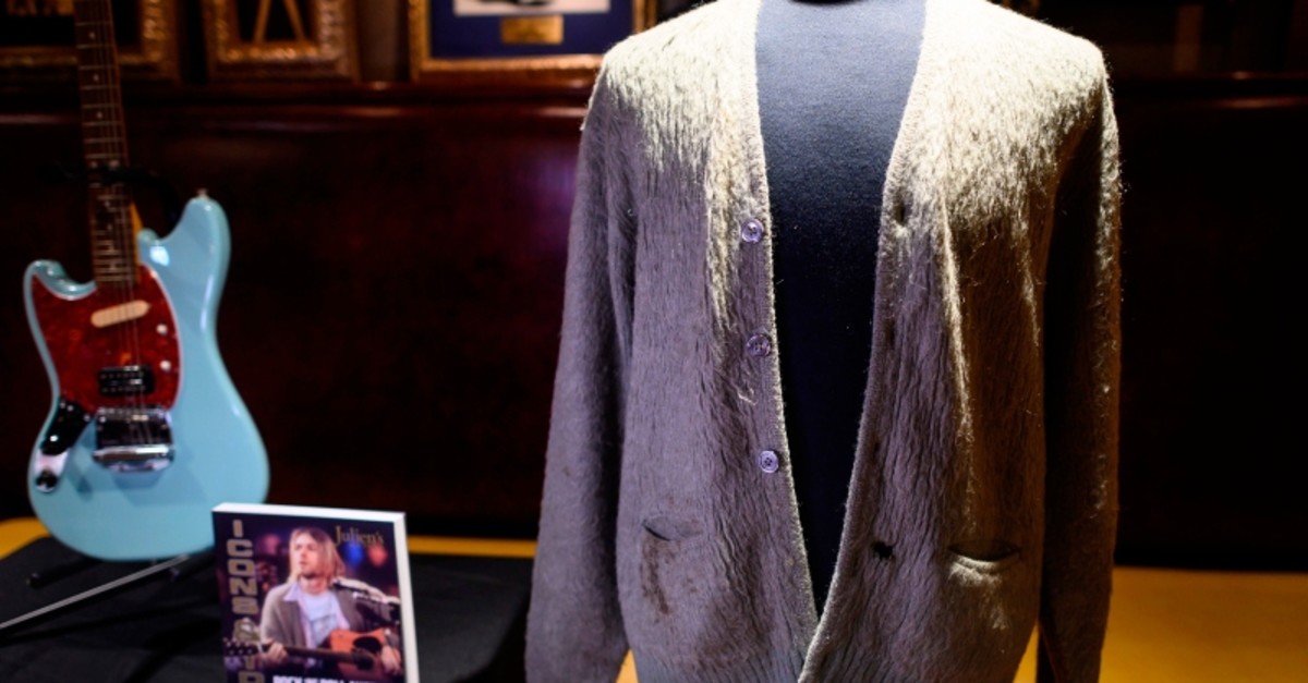Kurt Cobain's cardigan from Nirvana's 1993 MTV Unplugged performance is on display at the Hard Rock Cafe in New York City ahead of the auction of Julien's Auctions, Oct. 21, 2019 in New York. (AFP Photo)