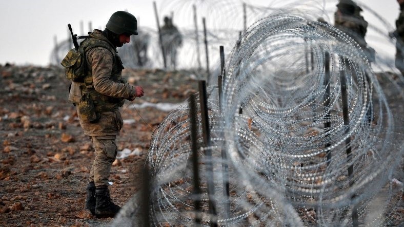 A Turkish soldier standing near wire fence as Operation Euphrates Shield, a counter-terror offensive starting on August 2016 by Turkish-backed Free Syrian Army to clear the Syrian towns from Daesh and PKK-affiliated terrorist groups, is continuing.