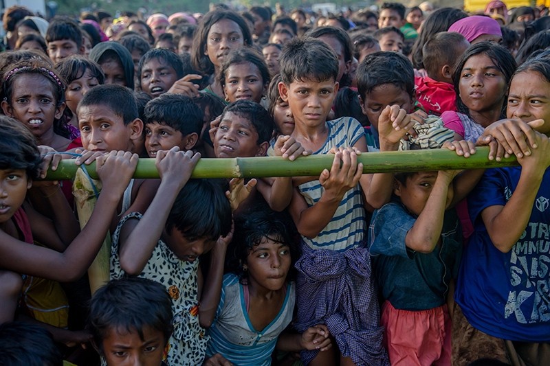 In this Sept. 25, 2017 file photo, Rohingya Muslim children, who crossed over from Myanmar into Bangladesh, wait to receive handouts near Balukhali refugee camp, Bangladesh. (AP Photo)