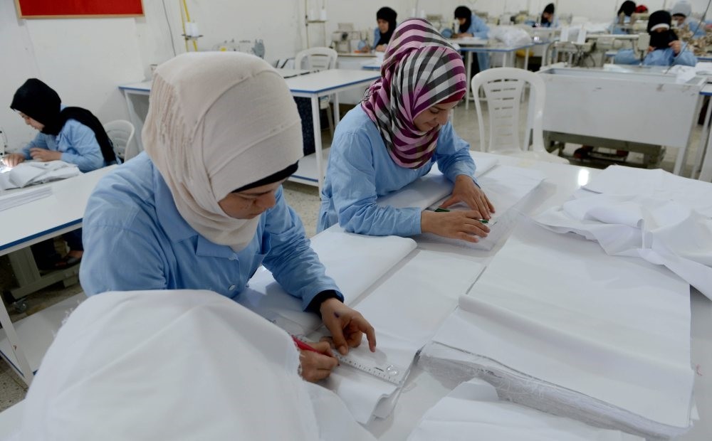 Syrian women working in a textile workshop in the city of Kilis.