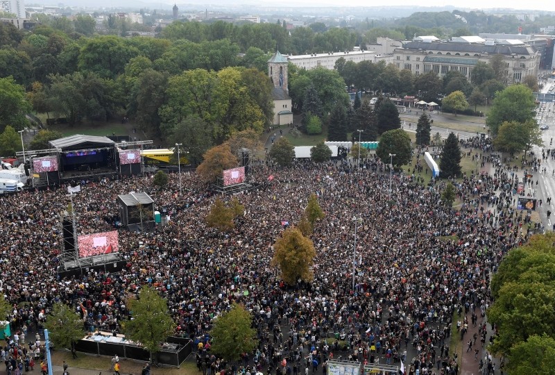 Concert goers stand in front of a stage in Chemnitz, Germany, September 3, 2018. 