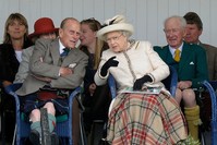 This file photo taken on September 06, 2014 shows Britain's Queen Elizabeth II and her husband Prince Philip (L) attending the Braemar Gathering in Braemar, central Scotland. (AFP Photo)