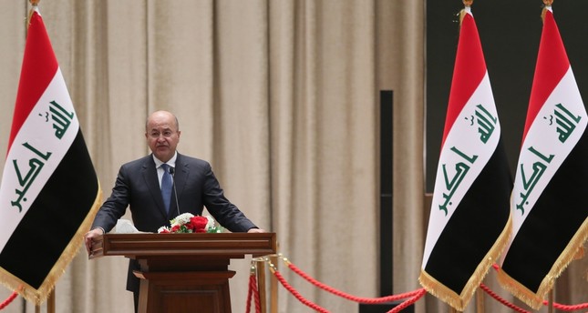 The newly elected Iraqi President Barham Salih delivers a speech at the parliament in Baghdad, Oct. 2.