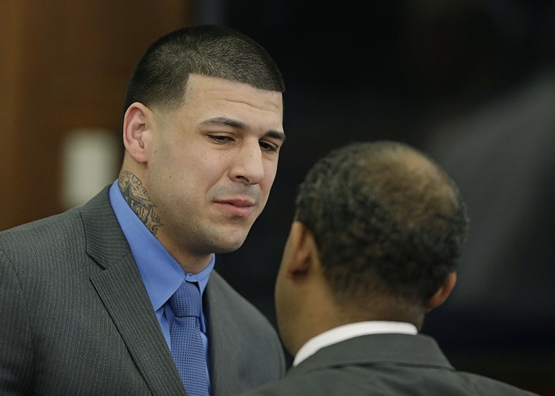 Former New England Patriots tight end Aaron Hernandez cries as he turns to defense attorney Ronald Sullivan reacting to his double murder acquittal at Suffolk Superior Court Friday, April 14, 2017 in Boston. (AP Photo)