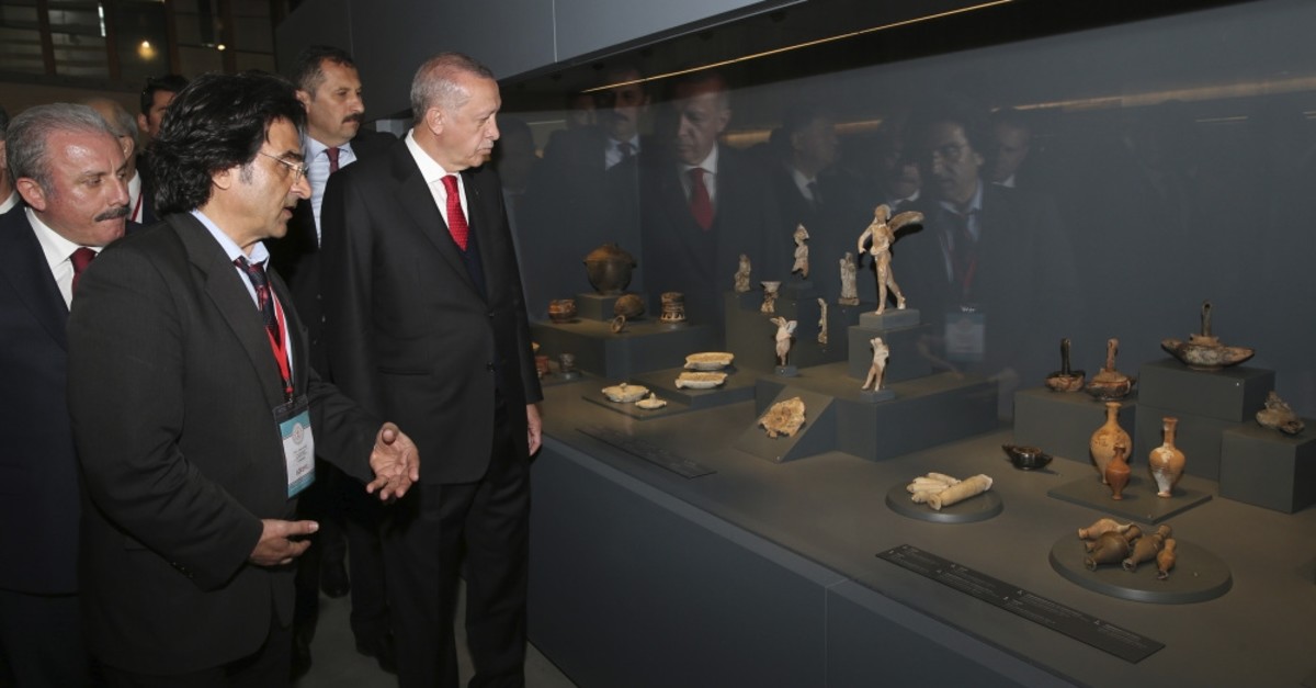 President Erdou011fan examined the pieces at the Troy Museum.