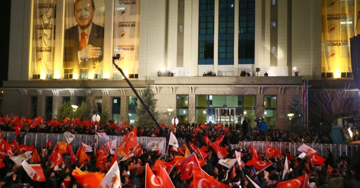 AK Party supporters wave flags after the results of the local elections in front of the AK Party headquarters in the capital Ankara, April 1, 2019. 