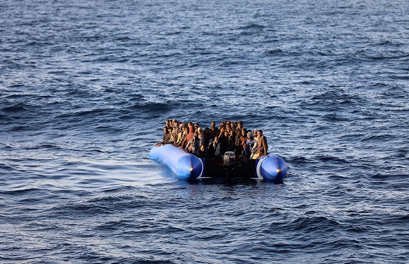Migrants in a dinghy are rescued by Libyan coast guards off the coast of Garabulli, east of Tripoli, Libya, January 8, 2018. (Reuters Photo)