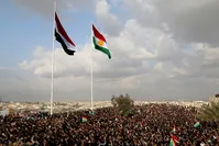 Iraqi and KRG flags seen together during Nevruz celebrations in Kirkuk's historic citadel, March 20, 2017. (AA Photo)