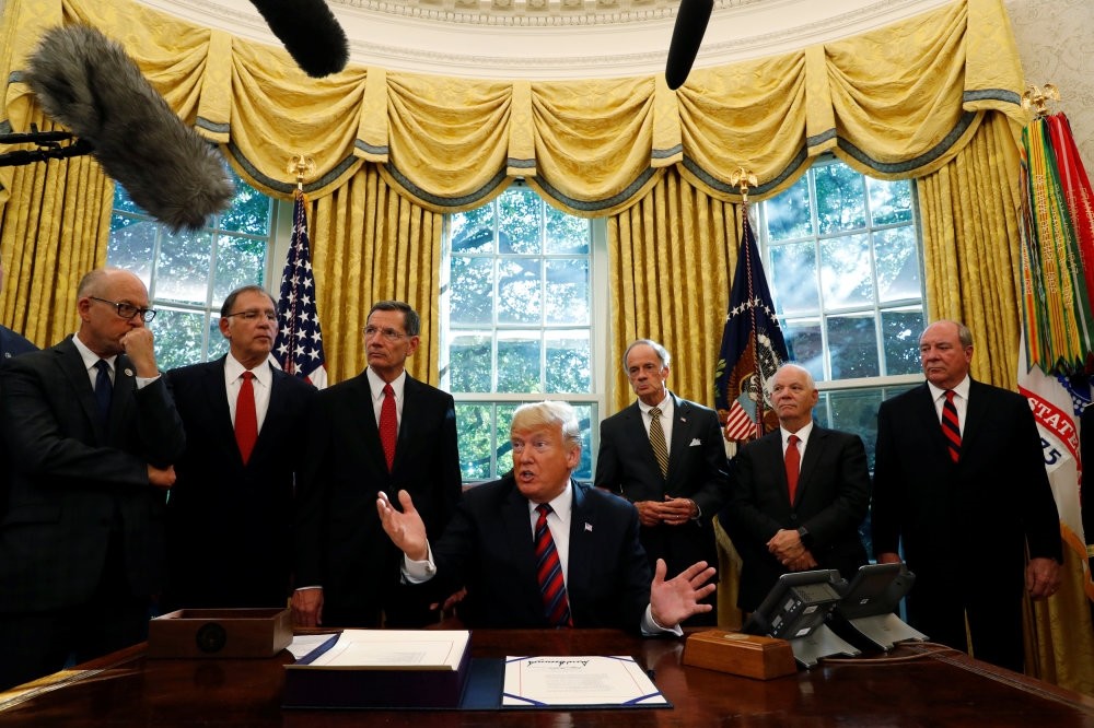 U.S. President Donald Trump talks to reporters about the killing of journalist Jamal Khashoggi in Turkey during a bill signing ceremony at the White House in Washington, Oct. 23.