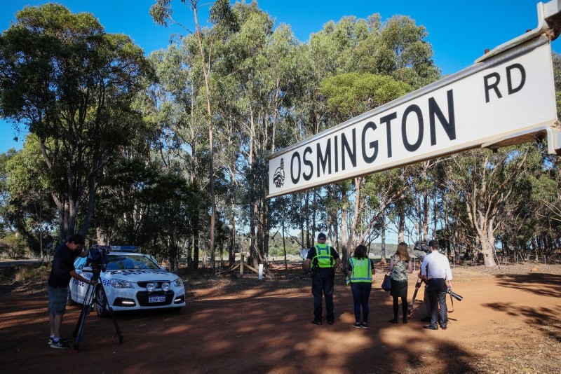 Media film a property from a police roadblock where police are investigating the deaths of seven people in suspected murder-suicide in Osmington, east of Margaret River, 260 kilometers southwest of Perth, Australia, May 11, 2018. (EPA Photo)