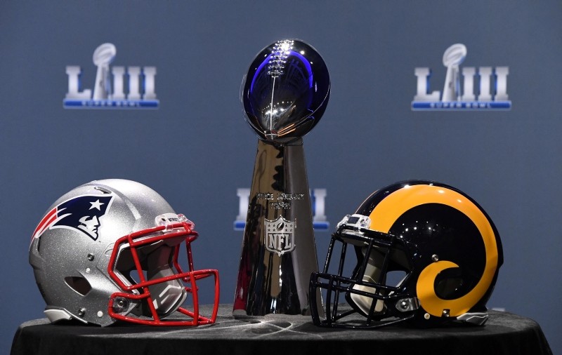 The Vince Lombardi Trophy and helmets for the New England Patriots and Los Angeles Rams are displayed before the Roger Goodell press conference in advance of Super Bowl LIII at Georgia World Congress Center. (Reuters Photo) 