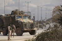 Turkish military convoy drives in Idlib province, Syria, Saturday, Feb. 22, 2020. (AP Photo)