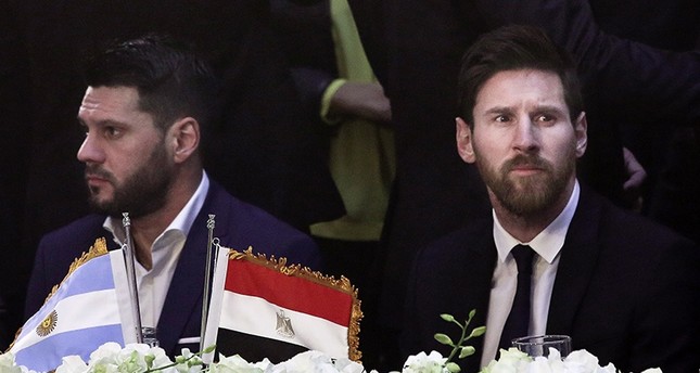 In this Tuesday, Feb. 21, 2017, file photo, FC Barcelona's Lionel Messi, right, attends a gala dinner held at the Mena House in Giza. (AP Photo)
