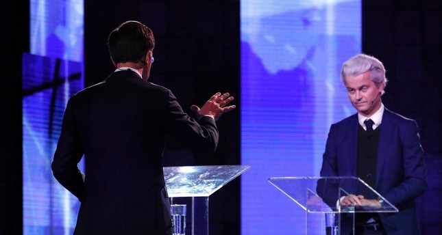 Dutch Prime Minister Mark Rutte (L) gestures while debating with the Netherlands' far-right politician Geert Wilders in Rotterdam on March 13, prior to the Dutch parliamentary elections held on March 15.