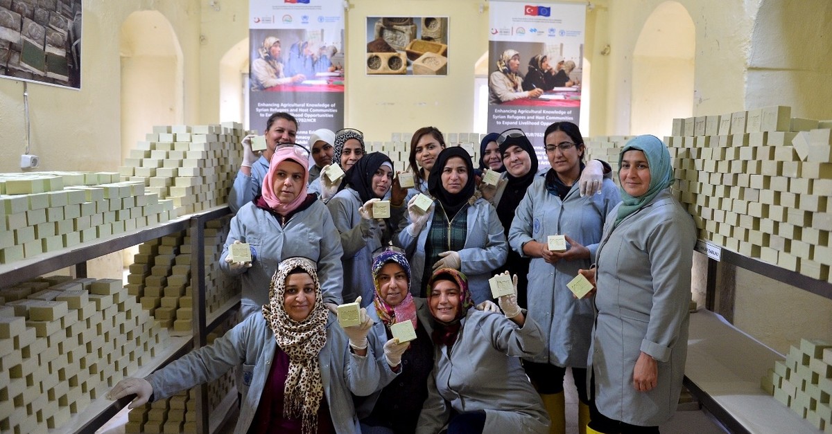 Syrian and Turkish women show Aleppo soaps they made together in their workshop in Mardin, Feb. 21, 2019.