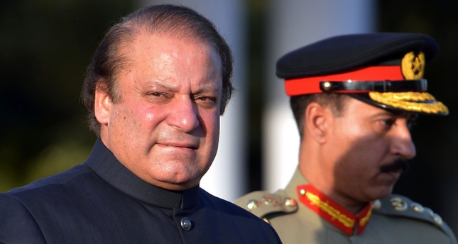 In this file photograph taken on June 5, 2013, Pakistani Prime Minister Nawaz Sharif arrives to inspect a guard of honour during a welcoming ceremony at the Prime Minister's House in Islamabad. (AFP Photo)