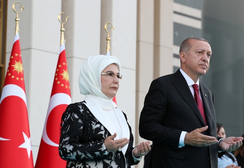 Erdoğan, next to his wife Emine ErdoĞan, prays during a ceremony at the Presidential Complex in Ankara, on July 9, 2018