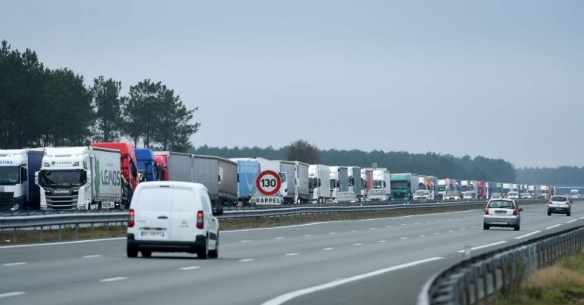 Trucks block the A63 highway during a national strike in France, Dec. 7, 2019. (AFP Photo)