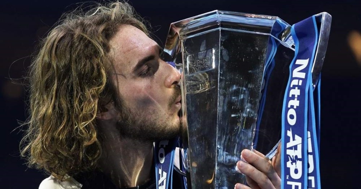 Tsitsipas kisses his trophy after winning the ATP Finals in London, Britain, Nov. 17, 2019. (EPA Photo)