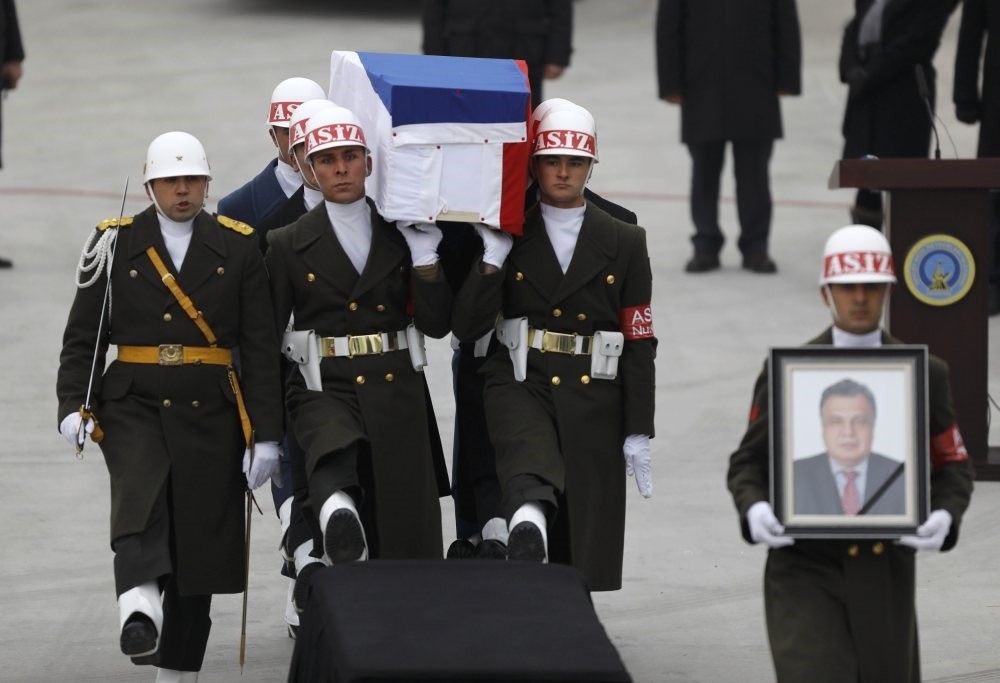 The flag-wrapped coffin of late Russian Ambassador to Turkey Andrei Karlov is carried to a plane during a ceremony at Esenbou011fa airport in Ankara, Turkey, Dec. 20, 2016.