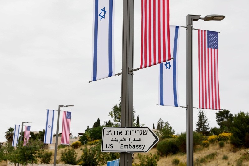 A new road sign and flags are placed at the road leading to the US consulate in the Jewish neighborhood of Arnona on the East-West Jerusalem line in Jerusalem, Israel, 08 May 2018. (EPA Photo)