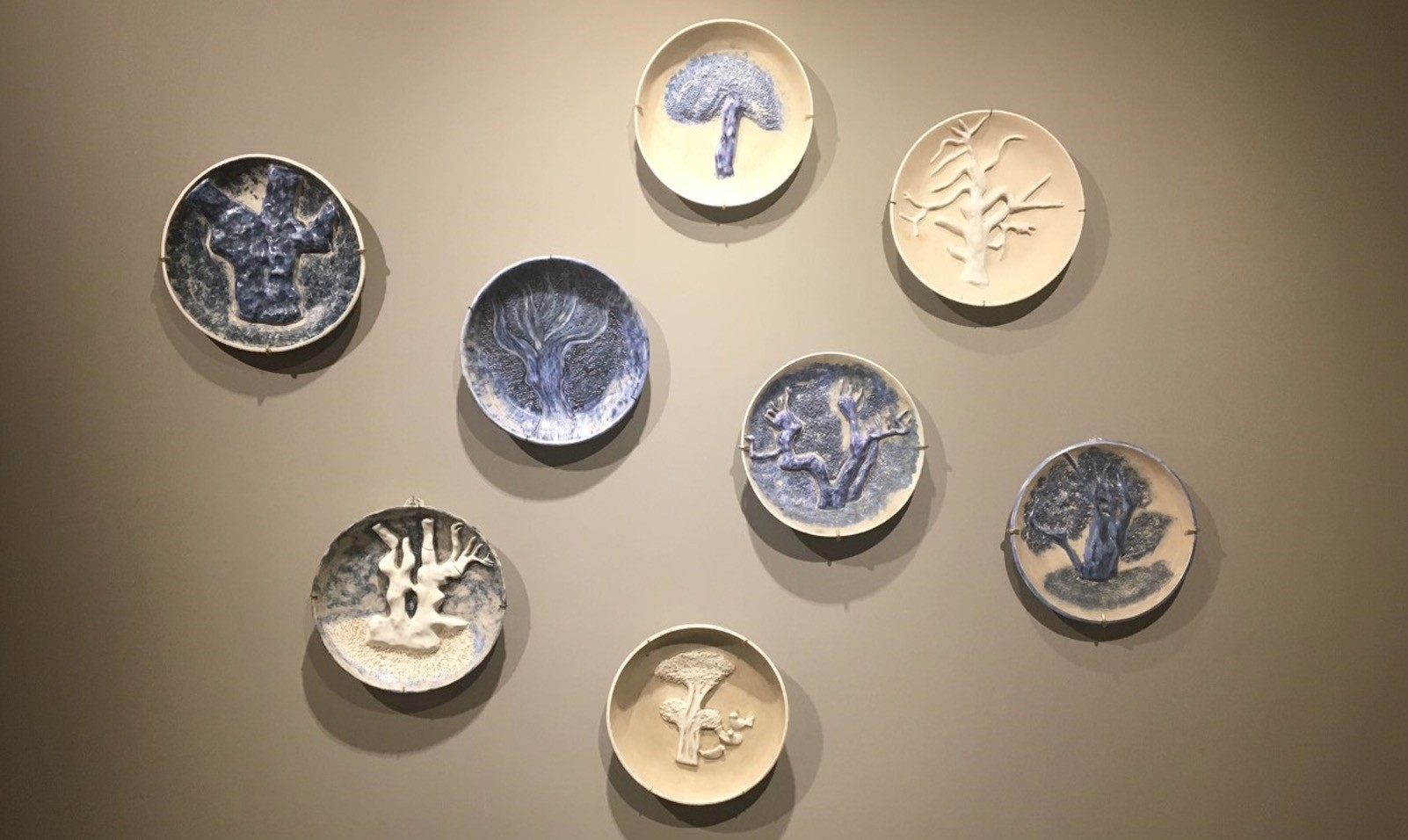 The plates represent her first masterfully creative phase designing ceramics with a syncretic sensibility for blending the themes of tradition and modernity into clay.