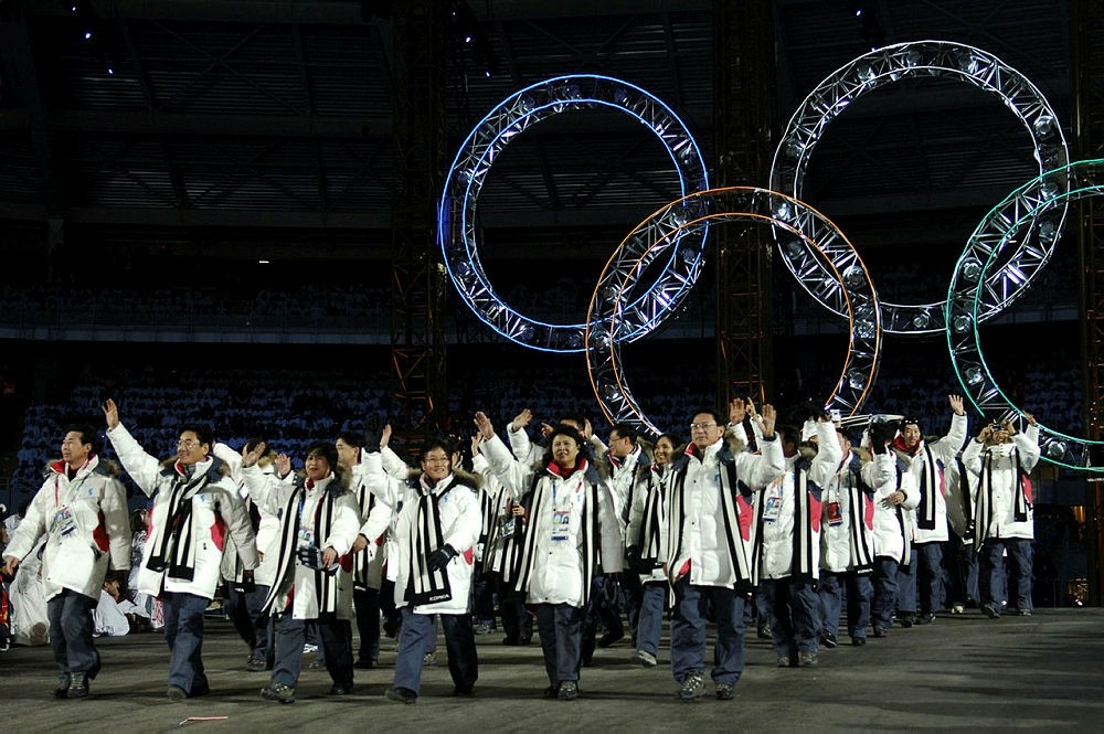 File photo taken on February 10, 2006 shows South Korean and North Korean athletes marching together during the opening ceremony of the 2006 Winter Olympics at the Olympic stadium in Turin. (AFP Photo)