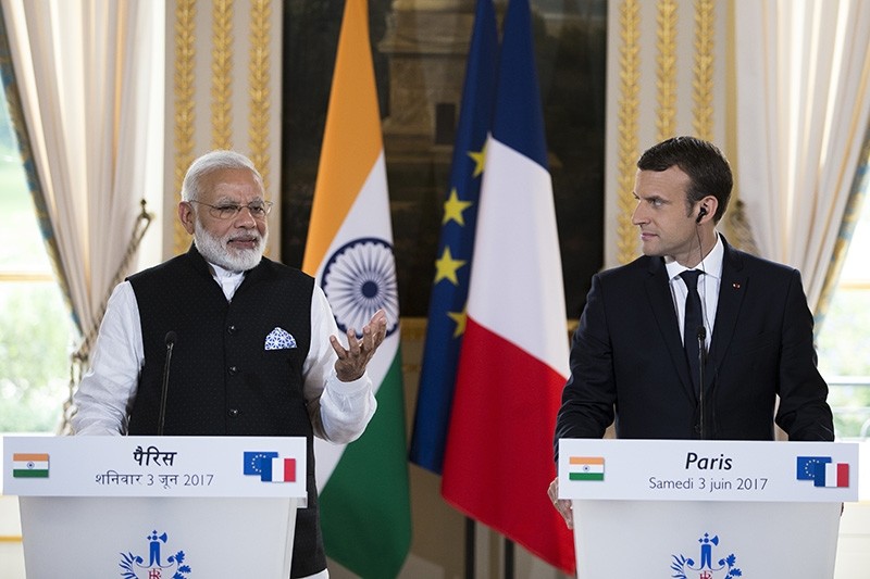French President Emmanuel Macron, right, and Indian Prime Minister Narendra Modi, deliver a joint statement after their meeting at the Elysee Palace in Paris (AP Photo)