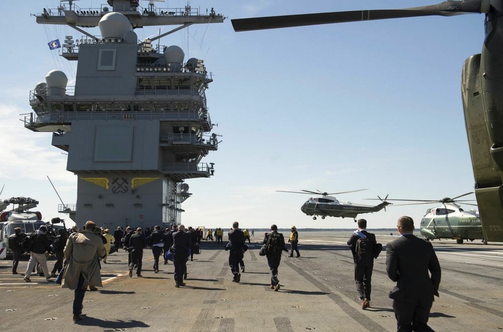 Marine One with US President Donald Trump aboard lands on the flight deck of the pre-commissioned  USS Gerald R. Ford aircraft carrier in Newport News, Virginia, March 2. (AFP Photo)