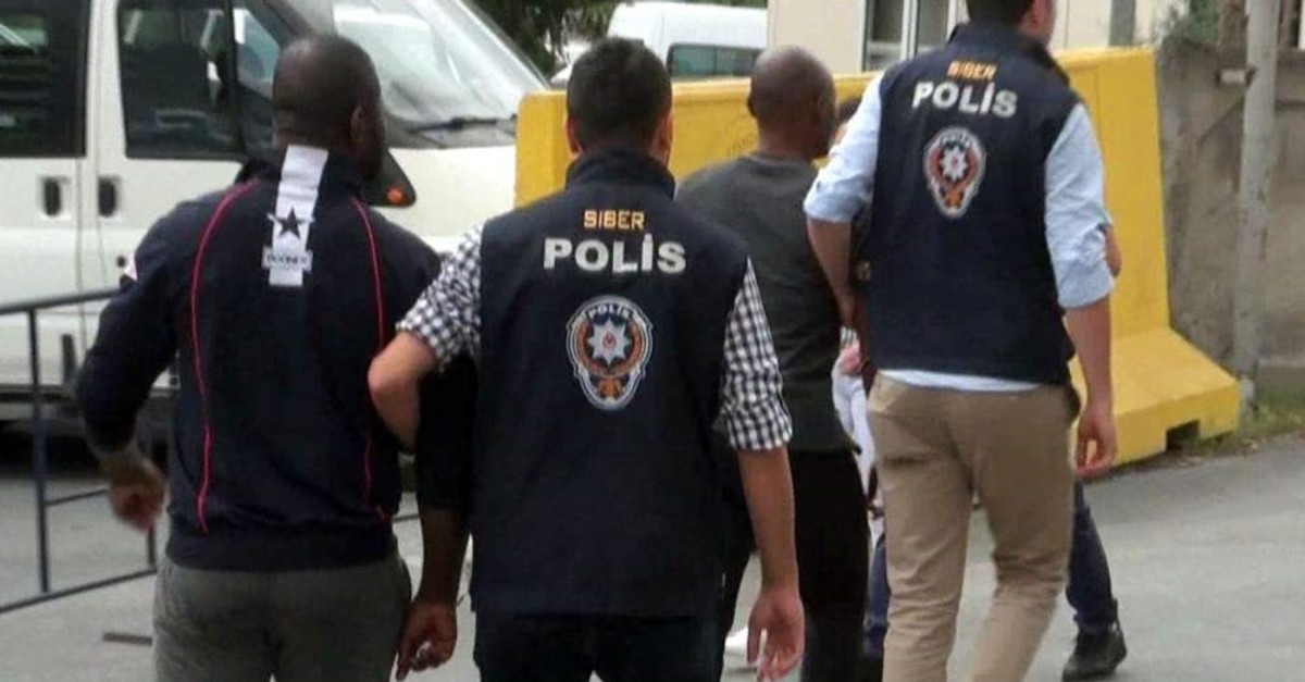 Istanbul police escort Nigerian suspects in another operation against a fraud gang in this 2018 photo. (PHOTO BY EM?R SOMER) 