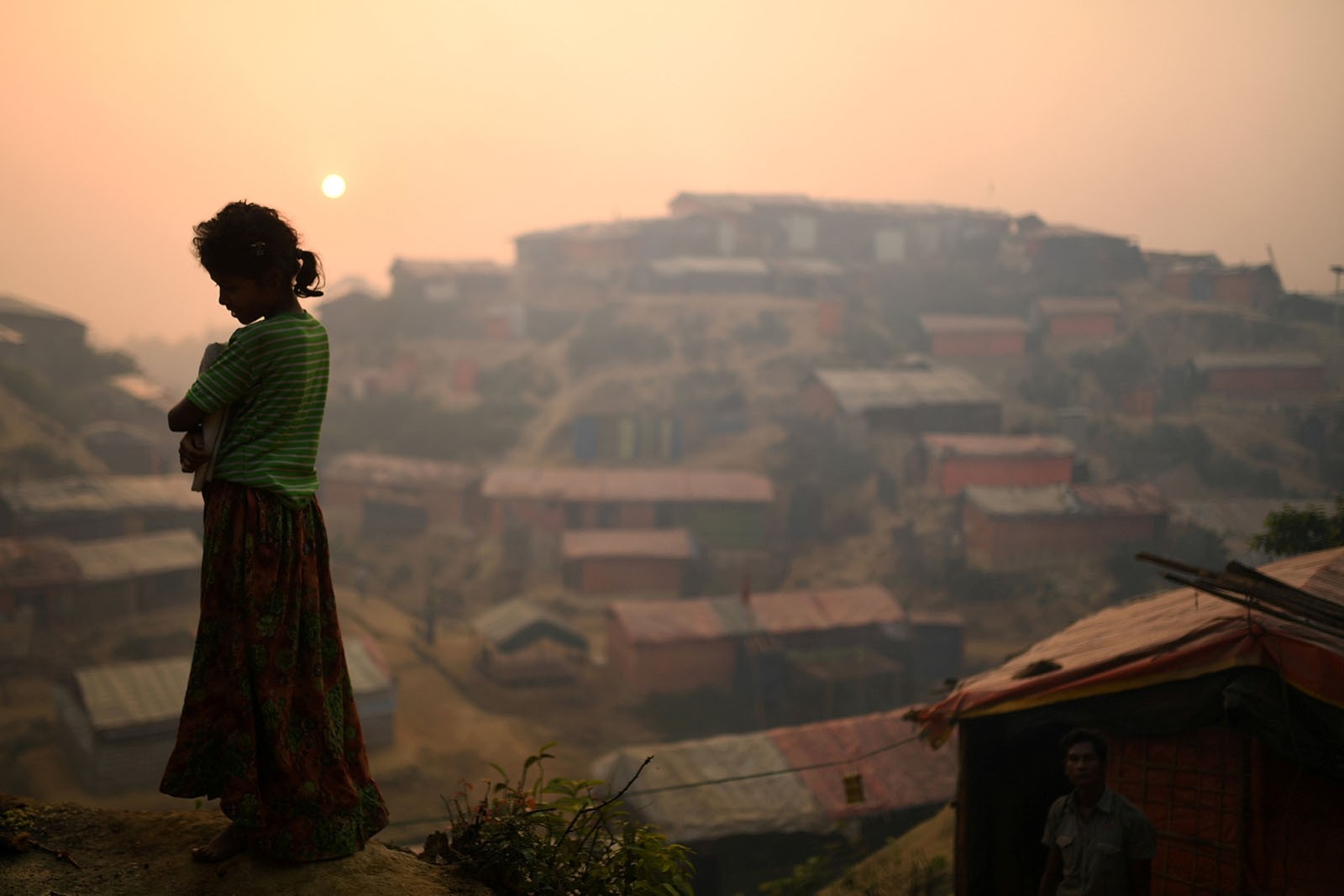 A Rohingya refugee is seen in Balukhali refugee camp at dawn near Cox's Bazaar, Bangladesh, March 28, 2018.