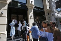 Tourists and Turks line up outside a luxury store in an upscale neighborhood, Istanbul, Aug. 14.