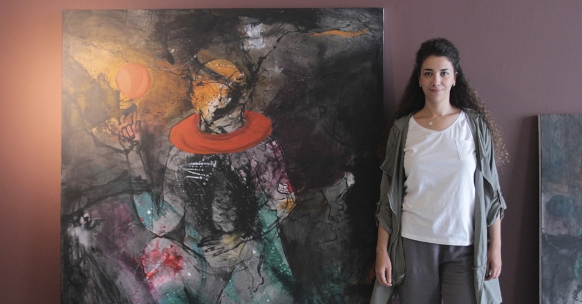Hiba Aizouq beside one of her artworks at CerModern.