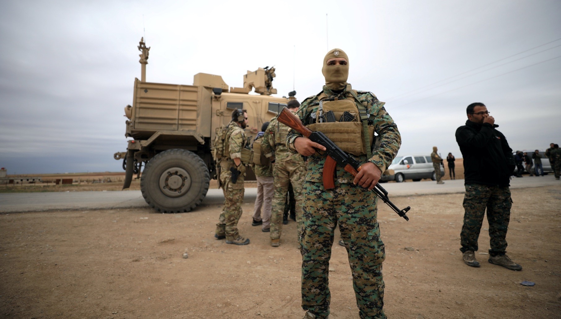 YPG and U.S. troops seen during a patrol near the Turkish border in Hasakah, Syria, Nov. 4, 2018.