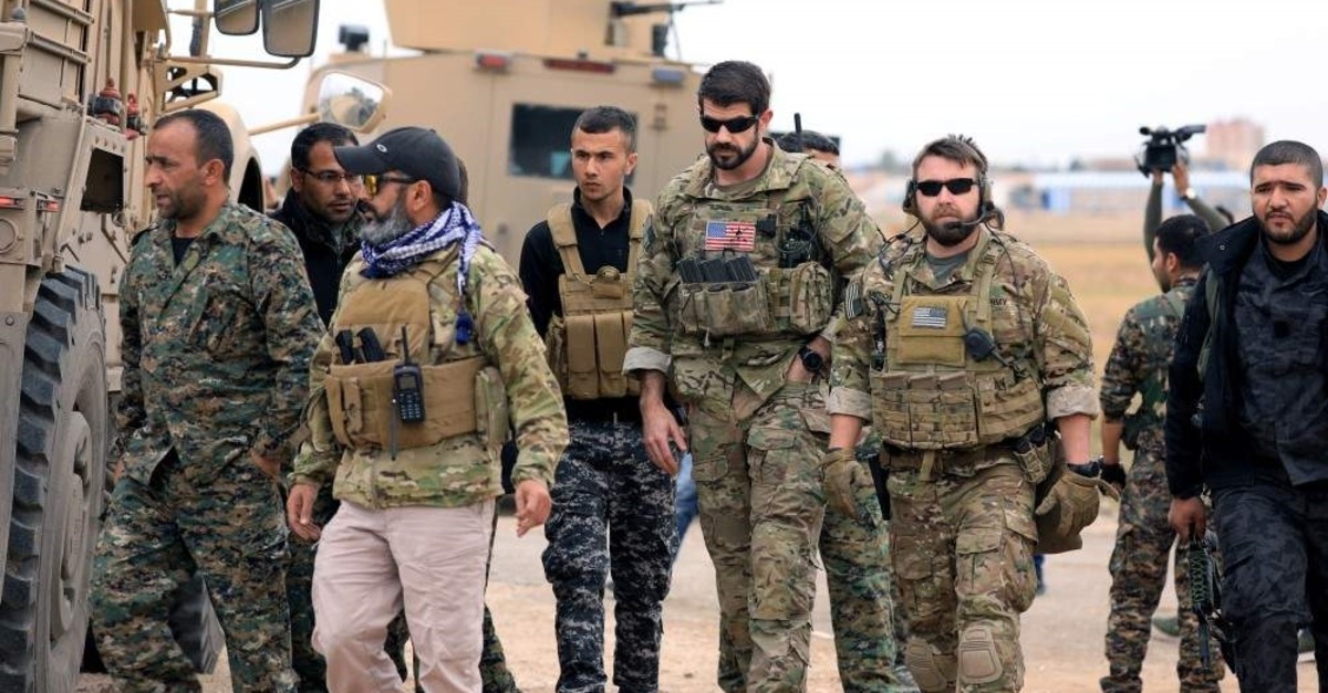 YPG terrorists and US troops seen during a patrol near Turkish border in Hasakah, Syria, Nov. 4, 2018 (Reuters File Photo)