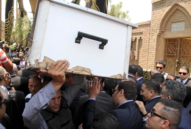 In this June 30, 2015 file photo, pall bearers carry the body of slain Egyptian Prosecutor General Hisham Barakat who was killed in bomb attack a day earlier, during his burial at a cemetery in Cairo. (AP Photo)