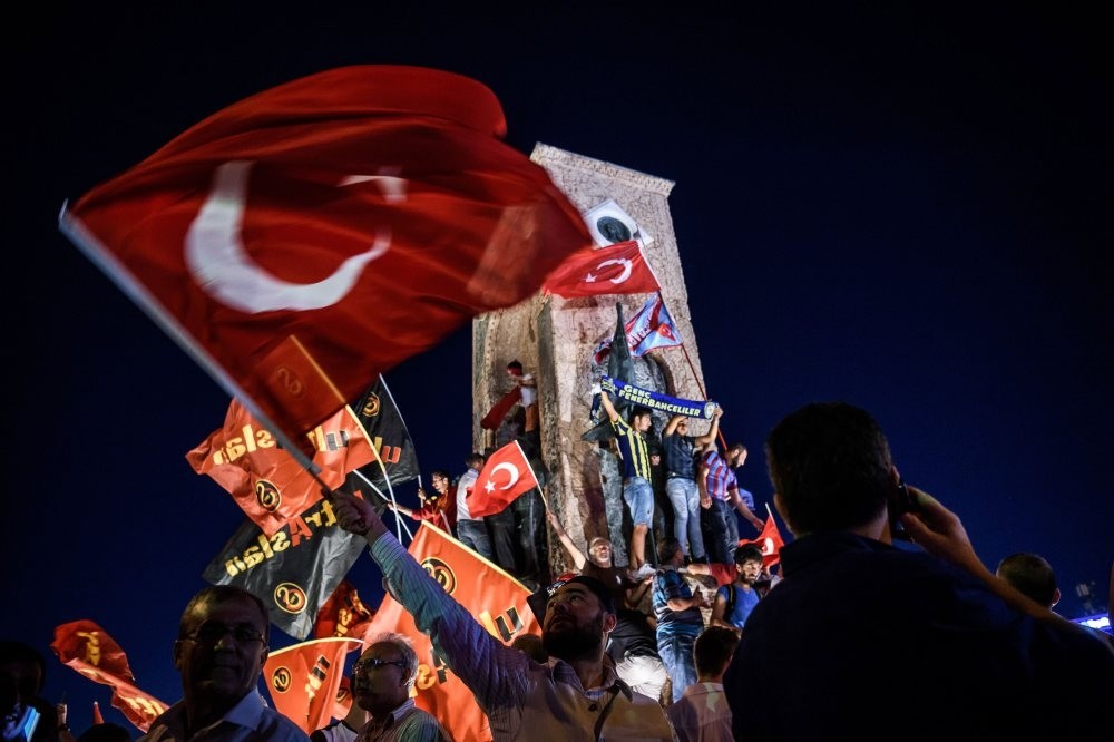 People celebrate the victory against the putschists at Istanbul's Taksim Square on July 23, 2016. On July 15, 2016, pro-coup officer Mu00fcslu00fcm Kaya ordered the attacks on an anti-coup crowd gathered at the same square.