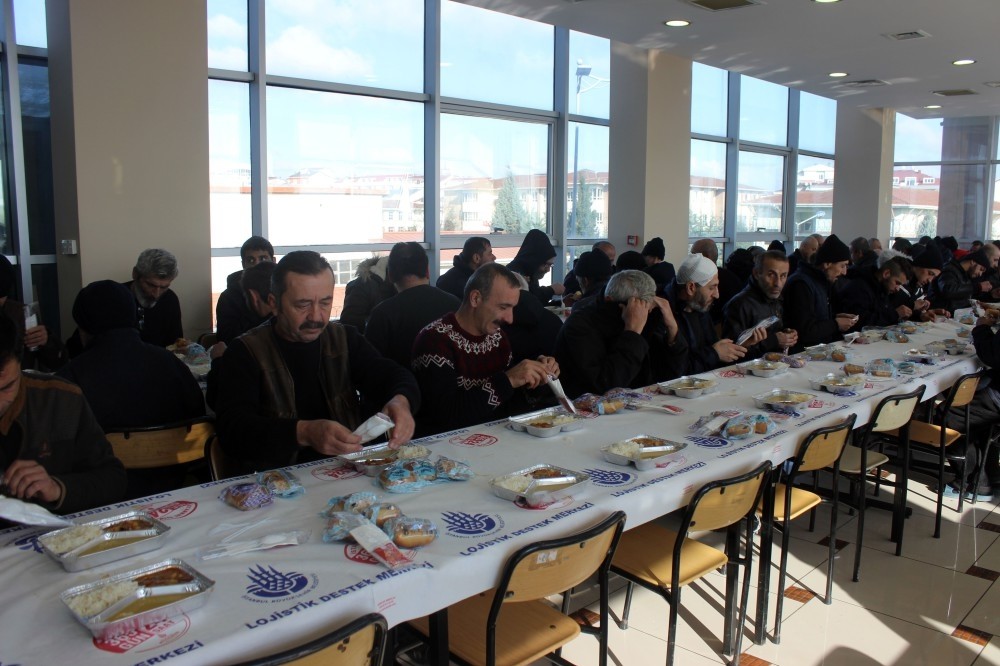 Homeless guests of municipality's shelter have lunch.