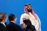 Saudi Crown Prince Mohammed bin Salman looks on as leaders arrive for a family photo at the G20 summit in Buenos Aires, Argentina Nov. 30.
