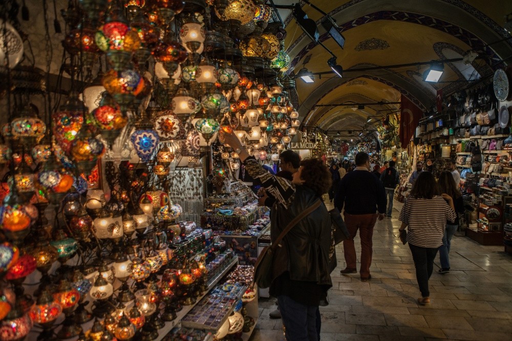 People examining various goods sold at Istanbulu2019s Grand Bazaar which dates back to the 15th century.