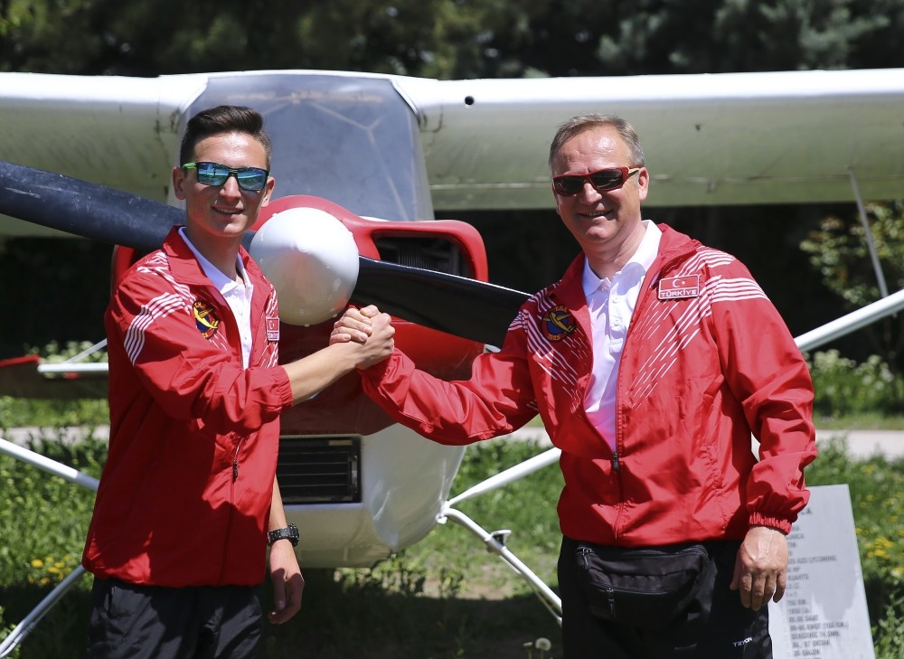 Kerem Dinu00e7er (L) and u0130brahim Dinu00e7er posing for the camera before travelling to Albania.