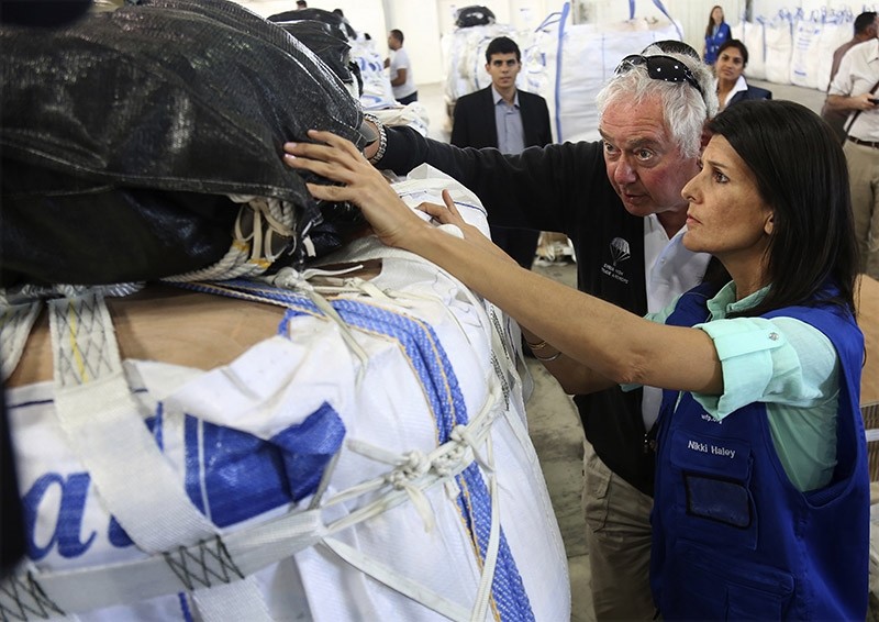 U.S. Ambassador to the United Nations Nikki Haley, inspects a food pallet to be air-dropped deep inside Syria, in Amman (AP Photo)